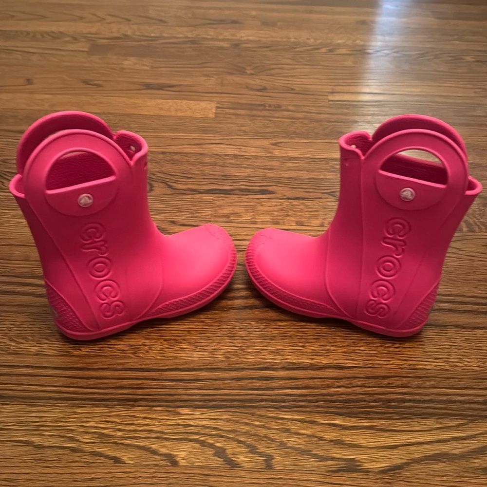 Pink Crocs rain boots